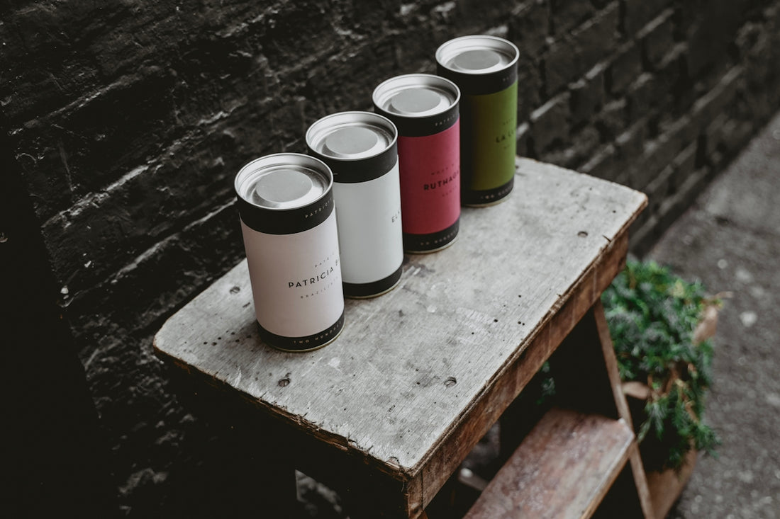 four tin cans on step ladder
