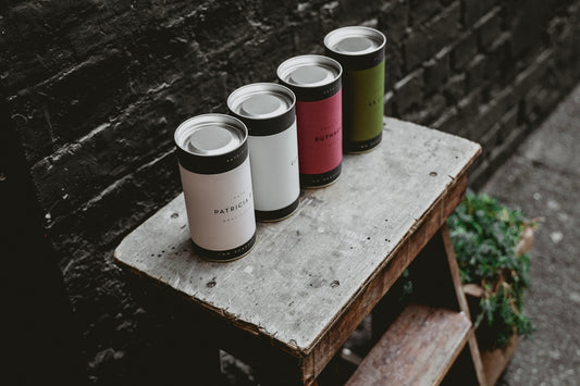 four tin cans on step ladder