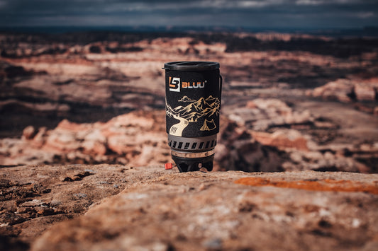 black and white can on brown sand during daytime