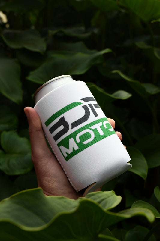 a person holding a can of beer in their hand